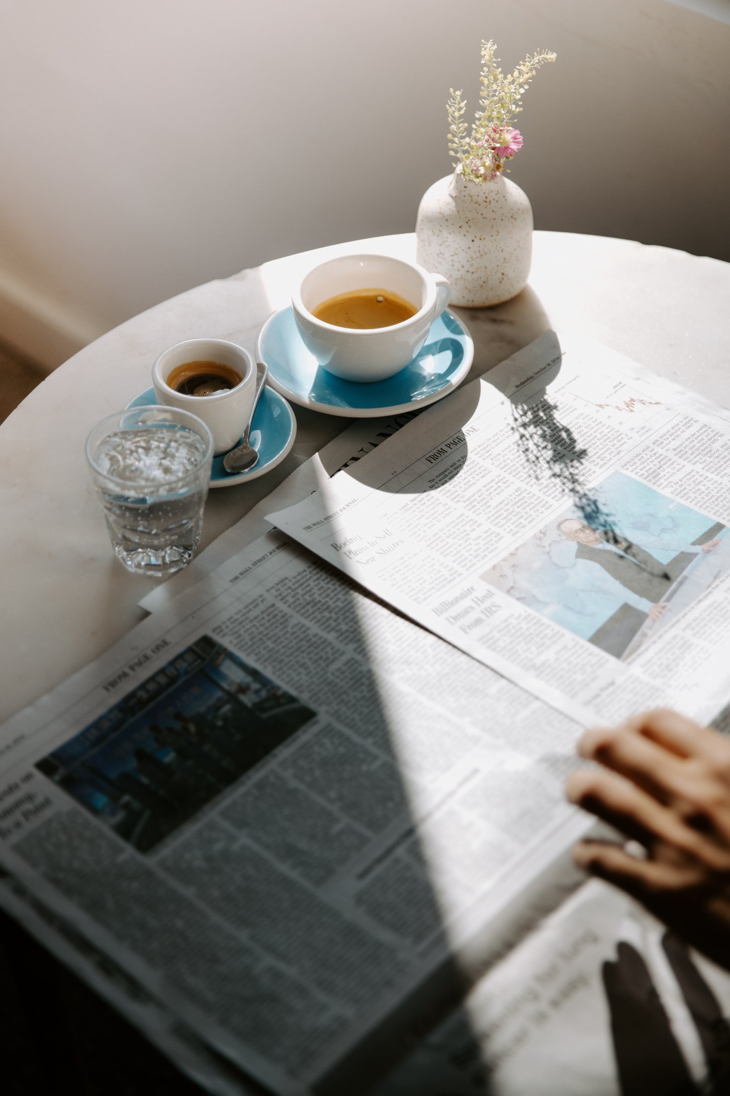 Espresso and cortado on a marble café table at Intermezzo, St. Petersburg FL — hospitality photography by Orange Grove Social